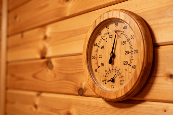 Thermometer indicating the ideal safe temperature range for infrared saunas
