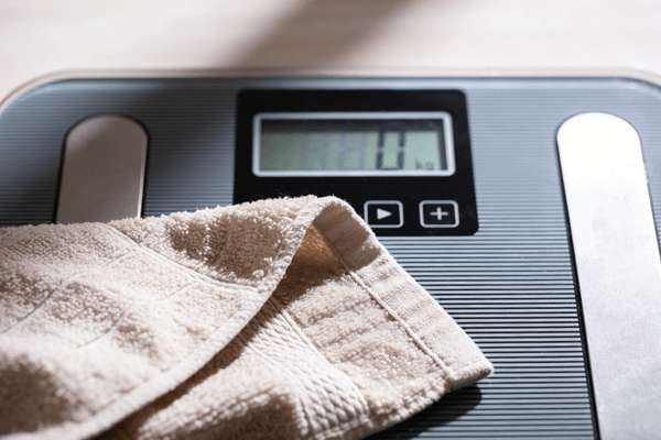 Fast Weight Loss Bathroom scale showing rapid weight drop after sauna session