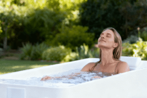 person in an ice bath demonstrating science-backed recovery and wellness benefits